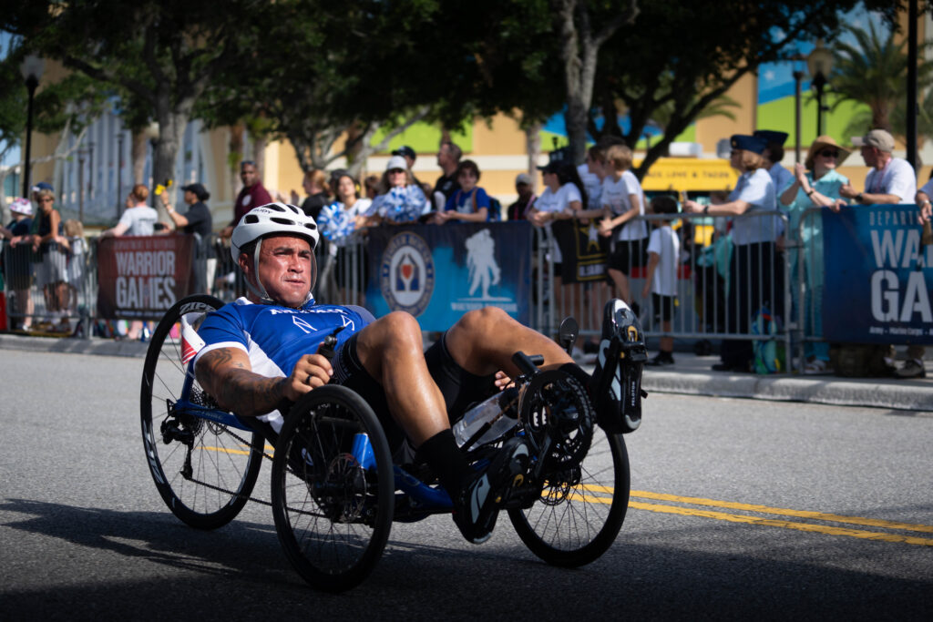 Team Air Force competitor, TSgt Christopher Ferrell (ret), cycling during the 2024 Warrior Games.